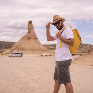 explorer-in-an-arid-national-park-looking-at-camer-2023-11-27-04-57-26-utc_Easy-Resize.com